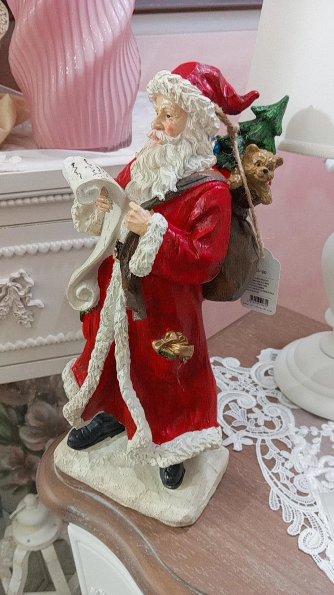 Babbo natale con pergamena l'arte di nacchi